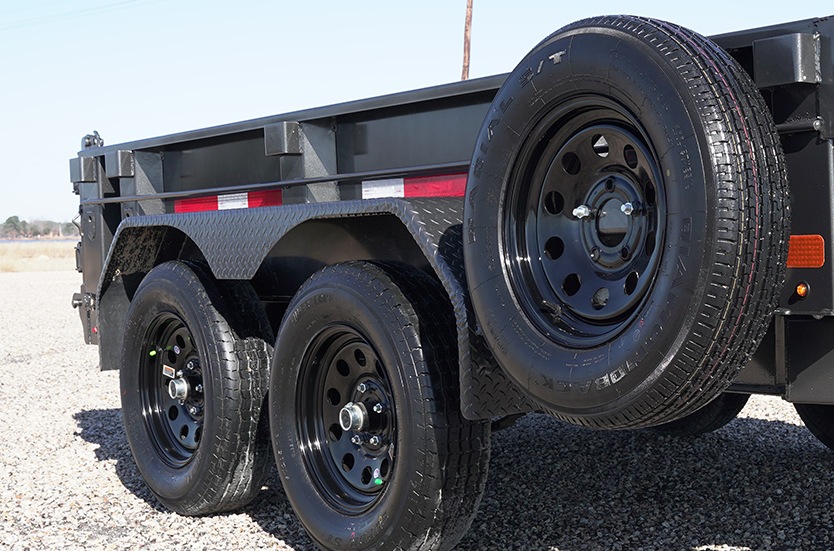 Silver double-axle horse trailer with windows, side view, parked outdoors